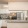 a kitchen with white cabinets and a breakfast bar