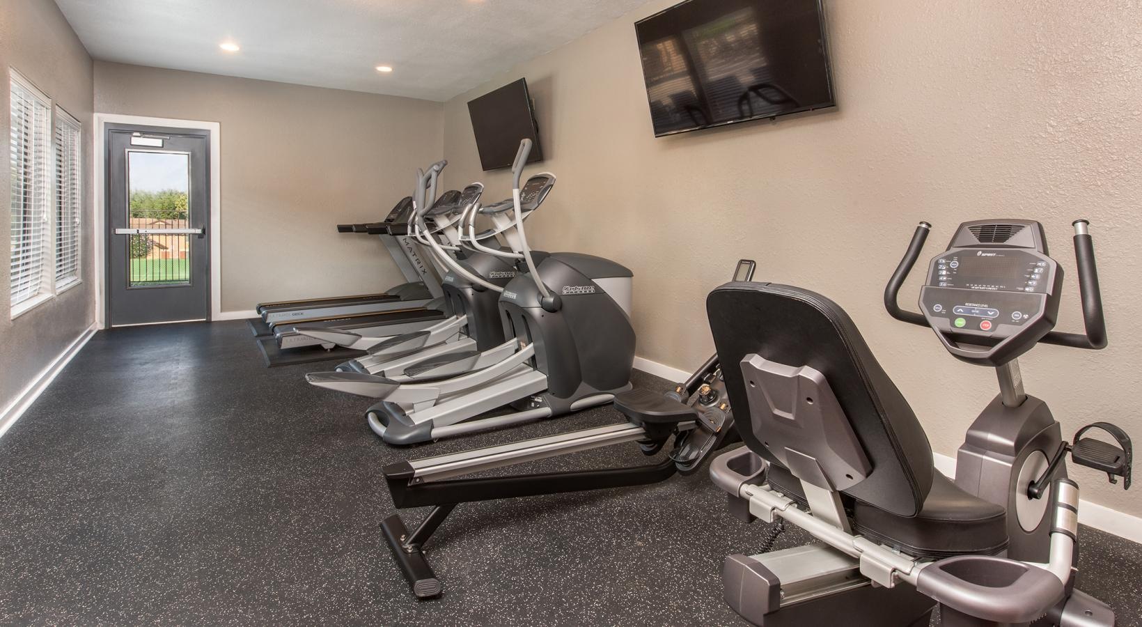 Access to resident-only features a room with exercise equipment