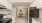 a kitchen with white cabinets a stovetop a fridge and a sink